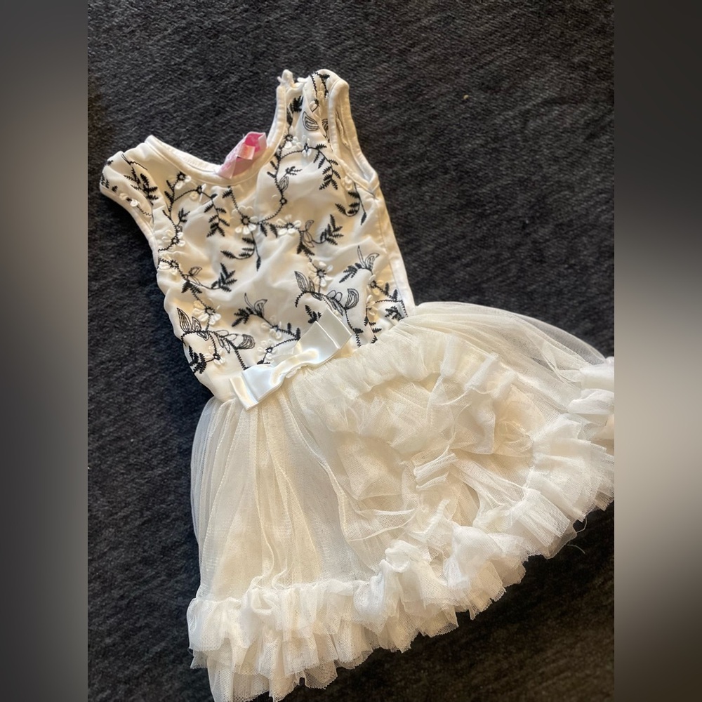 Brand :popatu size 18 months color, white, and black with stitched flowers